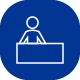 Icon of person standing behind desk