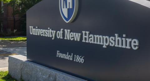UNH Sign and skateboarder