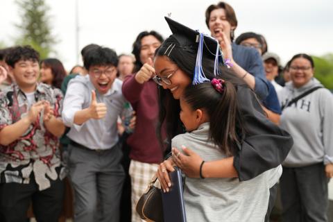 UNH student celebrating after COLSA commencement ceremony