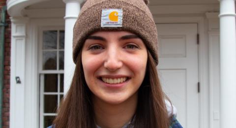 Student standing in front of Hood House