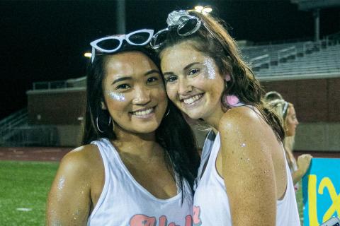 Two women posing together at Sorority Bid night