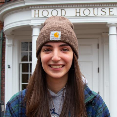Student standing in front of Hood House