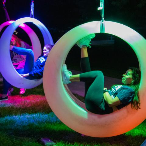 Students In colorful rings lawn on t