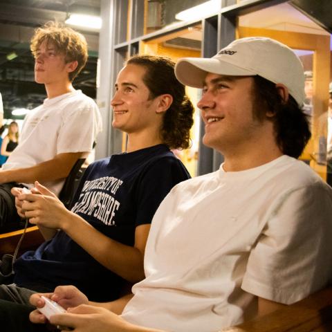 Two students playing Wii