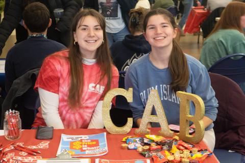 Students from CAB sitting at their table at the Student Org Fair.