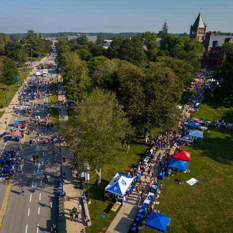 Aerial view of tables set up at UDay on lawn.