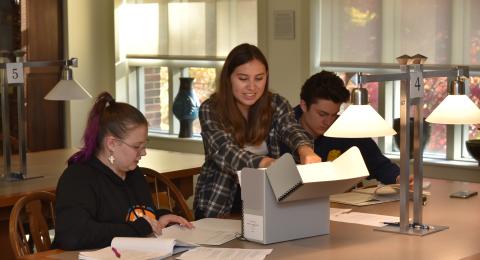 students working in the UNH archives