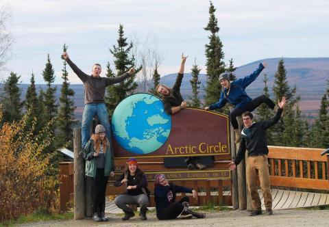 NSE students posing with Arctic Circle sign