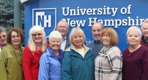 OLLI Leadership council spring 2023 group photo outdoors in front of UNH sign