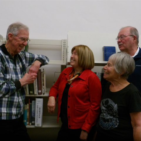 OLLI members discussing a new topic in the Conway Public Library