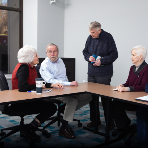 OLLI members in Greater Manchester discussing a book club read!