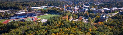 Aerial of campus over college woods