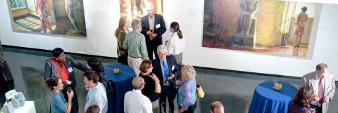 Faculty mingle at art gallery