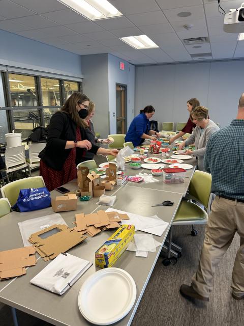 Enrollment staff putting together boxes of cookies