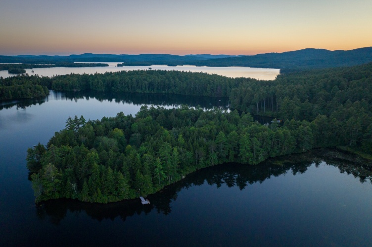 Aerial view of Squam Lake at sunset