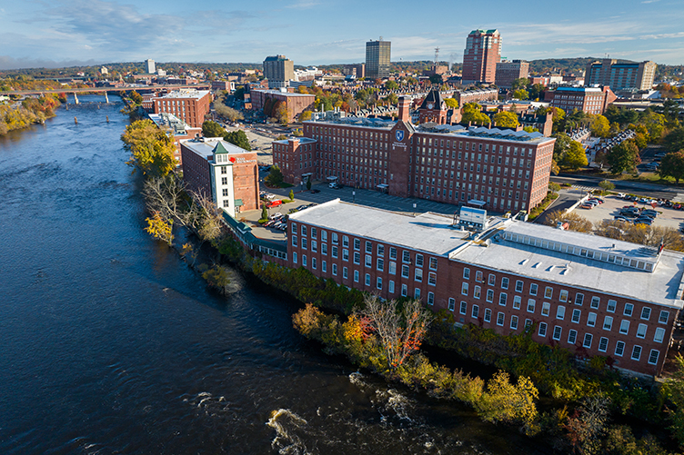 Aerial view of UNH Manchester alongside a body of water in Manchester