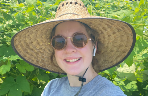UNH student Ella Lukacz on a farm