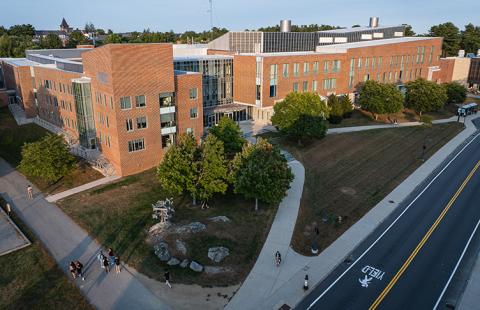 Aerial view of Kingsbury Hall, a brick academic building