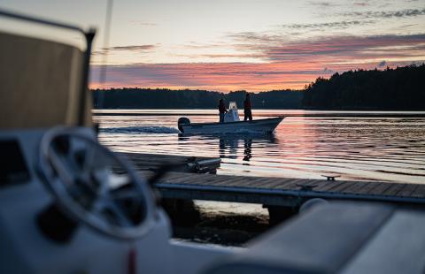 A UNH boat on Great Bay at sunrise