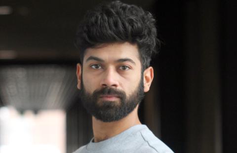 Portrait of dark haired male with beard