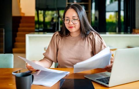Person Reading Paper