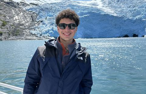 Portrait of Cole Robinson on a boat in the Arctic