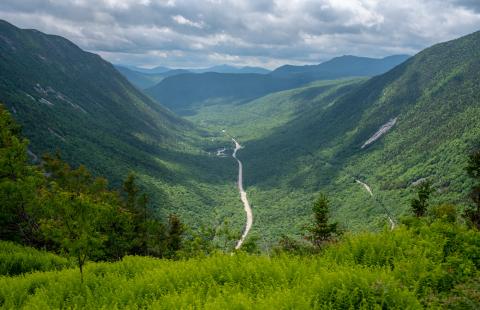 Drone image of White Mountains with a road down the middle