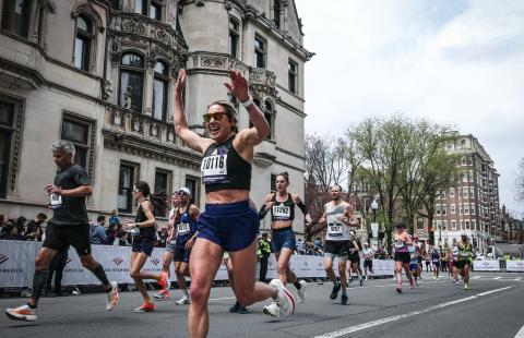 Kristina Robb ’24, ’26G prepares to cross the finish line at the Boston Marathon.