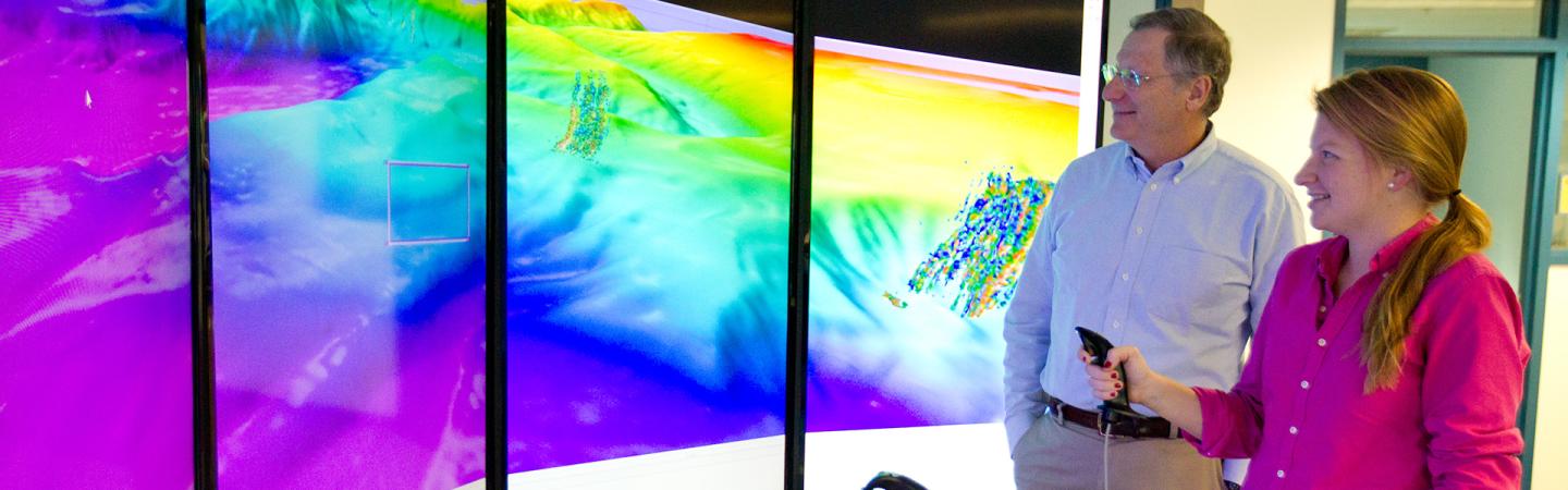 Researchers viewing data