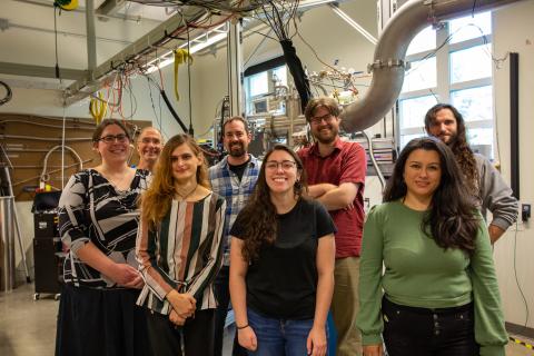 UNH physicists stand in front of polarized target