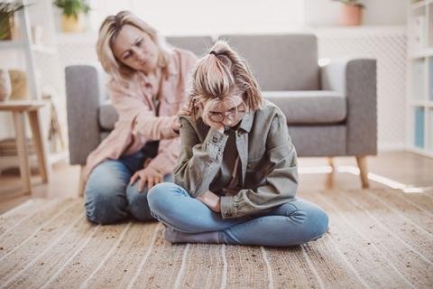 woman comforting teen