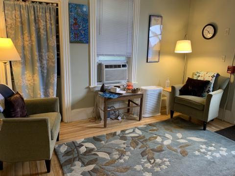 SHARPP advocate room with 2 arm chairs, lamps, and coffee table