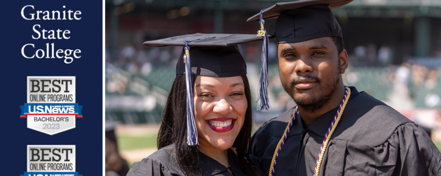 Two graduates posing for photo