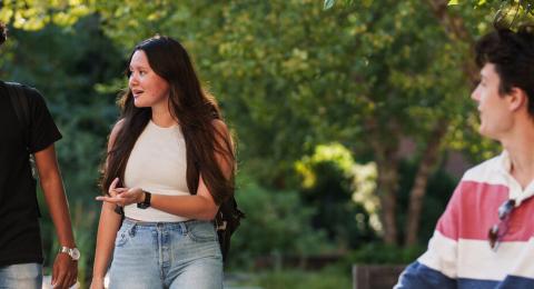 students on campus walking and talking