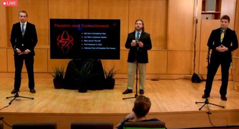 ATHANIEL HUNT '21 (CENTER) PRESENTING IN THE FINAL CHAMPIONSHIP ROUND OF THE HOLLOWAY PRIZE COMPETITION, WITH JOEY NELEBER ’22 (LEFT) AND BRAYDEN ESMAILI ’23 (RIGHT)