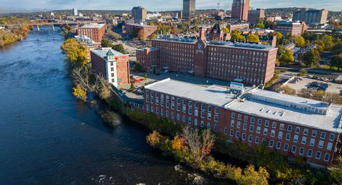 Aerial view of UNH Manchester alongside a body of water in Manchester