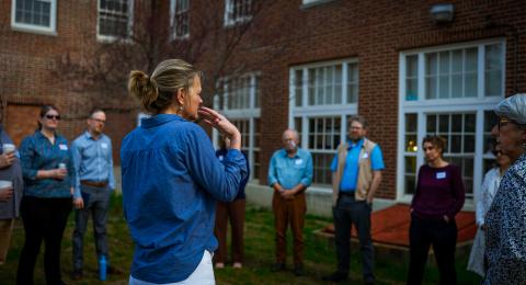 michele holt-shannon leading a group of people standing in a circle outside
