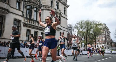 Kristina Robb ’24, ’26G prepares to cross the finish line at the Boston Marathon.