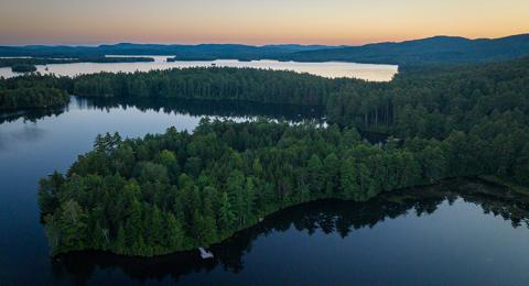 Aerial view of Squam Lake at sunset