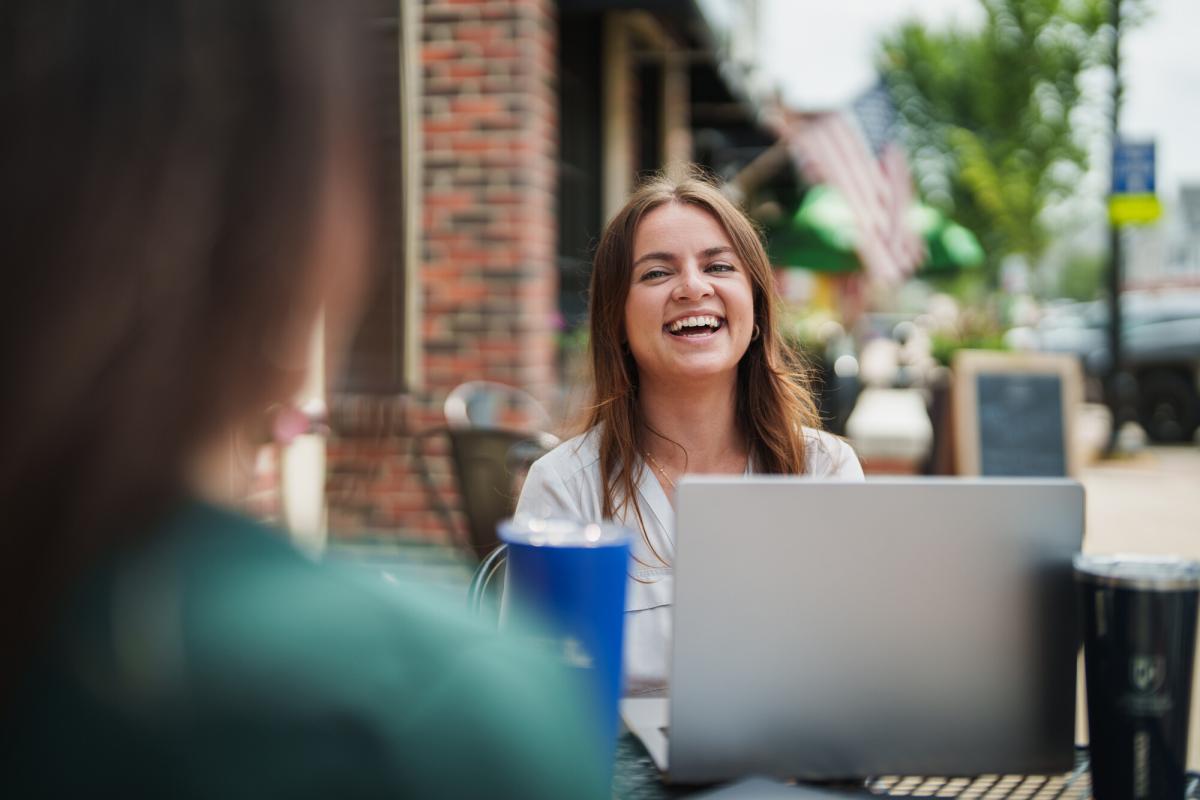 UNH online student working outside 