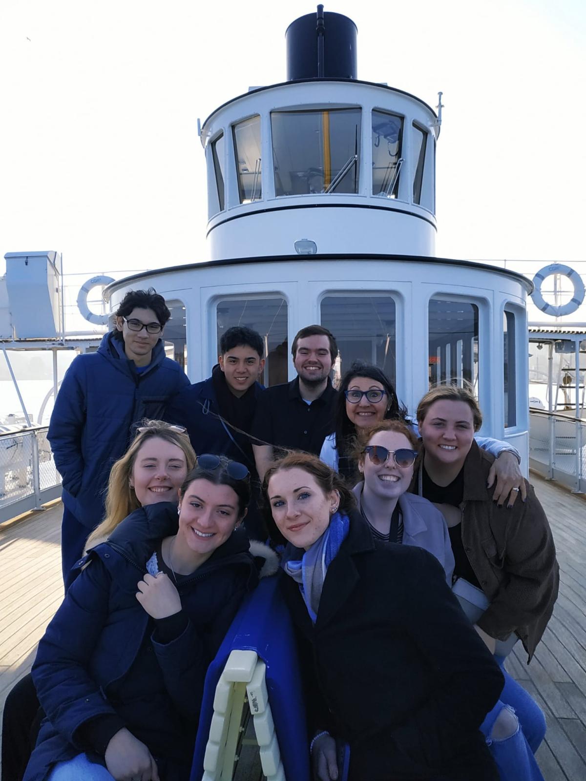 Emma on a boat with friends