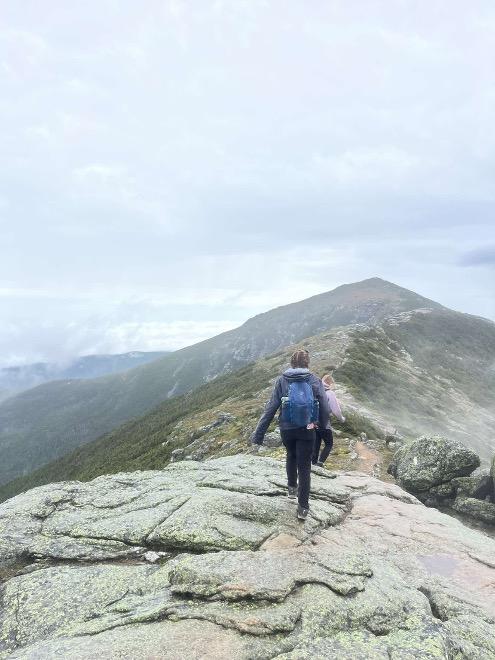 UNH student Taylor Berry hiking on UNH's campus