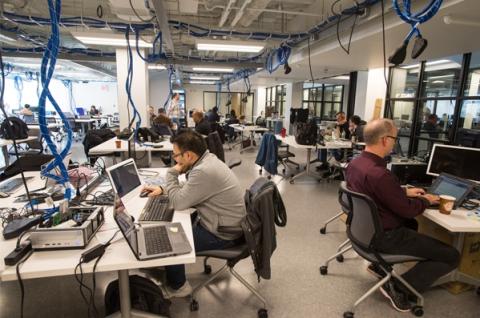 People using computers in UNH interoperability laboratory