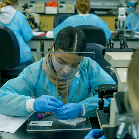 UNH student working in a science lab