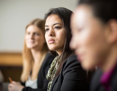 Three UNH law students listening in class