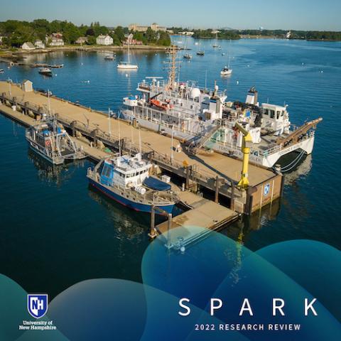 Aerial shot of research vessels at pier with words SPARK 2022 research review