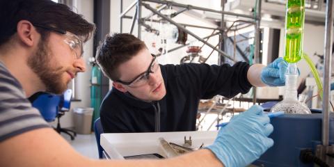 UNH Students working on a project in a science lab