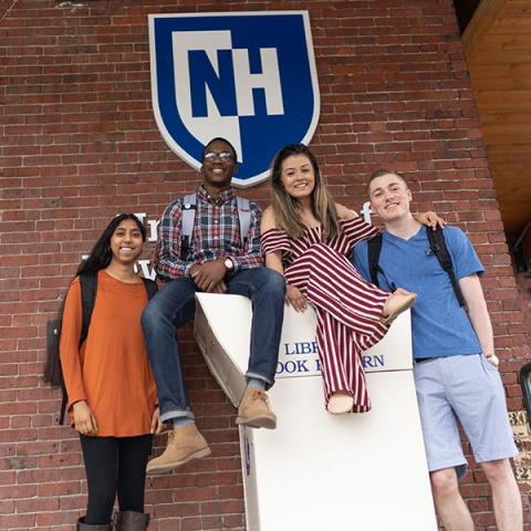 UNH Manchester students next to book return