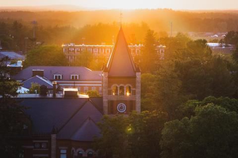 Thompson Hall's spire in misty bright sunlight