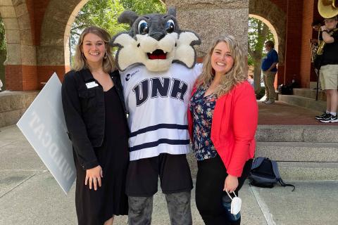 UNH student and CaPS staff with Wild E Cat